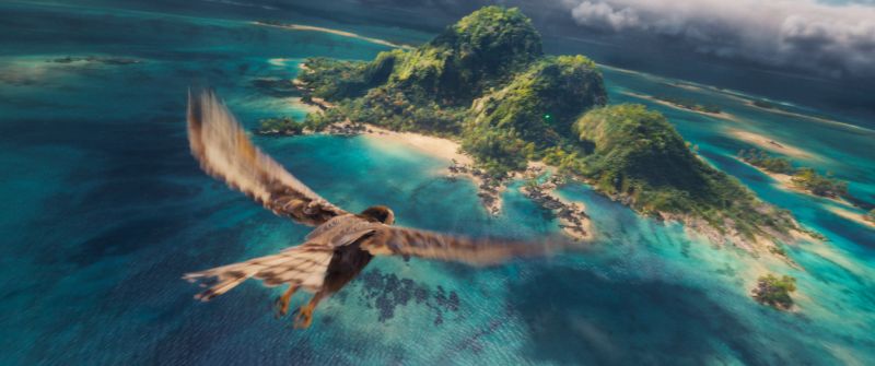 Isla — Paisaje polinesio Un ave sobrevuela una isla tropical rodeada de aguas turquesa.
