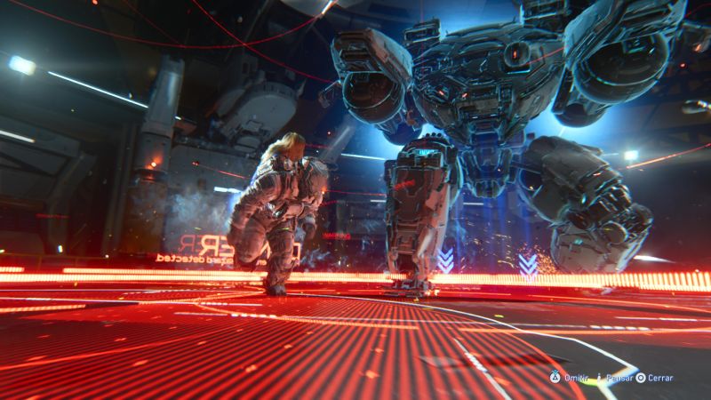 Confrontación mecánica – Pragmata Personaje enfrentando a un robot gigante en un entorno industrial iluminado en rojo y azul.