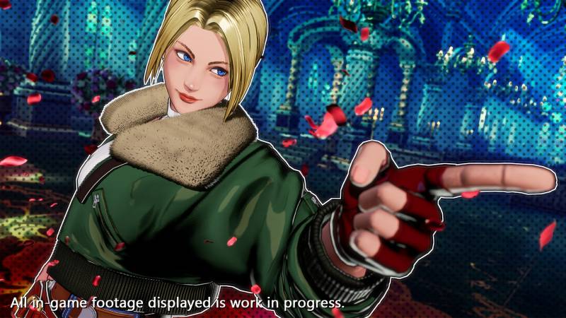 Blue Mary en FATAL FURY: City of the Wolves Personaje rubio con chaqueta verde y guantes rojos posando en un entorno interior azul con columnas y candelabros, acompañado por pétalos rojos en el aire.