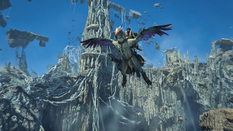 Un cazador montado en su Seikret sobrevolando las ruinas y estructuras de piedra de una nueva zona flotante.