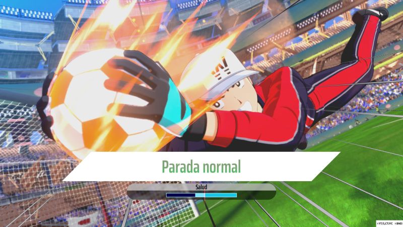 Atajada acrobática y atajada perfecta de Genzo Wakabayashi Genzo Wakabayashi estirándose acrobáticamente en el aire con guantes de portero para sujetar con firmeza un balón envuelto en fuego.